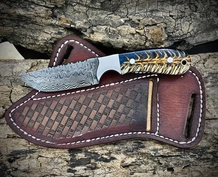 Traditional cowboy hunting knife with blue/white pine cone and pancake leather sheath image 0