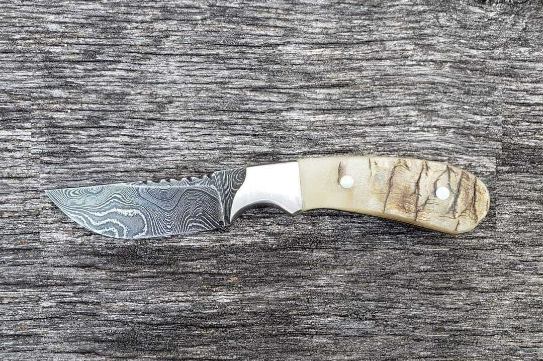 Damascus steel custom cowboy knife with sheep horn handle and western style leather sheath image 0
