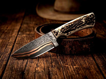 Copper Damascus steel Cowboy knife with Stag antler handle and pancake western style leather sheath