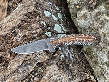 1085 carbon steel Cowboy knife with white pine cone handle and pancake leather cover image 0