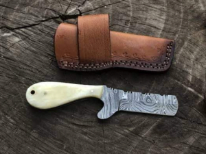 Bull Cutter Knife - Damascus steel blade with twist pattern, camel bone handle & horizontal sheath.