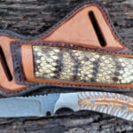 Handmade Damascus Steel Cowboy Knife - Hand-forged, full tang knife with a twisted Damascus steel blade, pine cone handle, and horizontal carry cross draw pancake leather sheath.