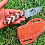 Damascus steel Cowboy knife with combined olive wood and rose wood handle.