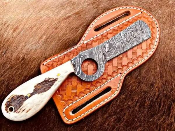 Damascus Cowboy bull cutter knife with stag antler handle & horizontal carry leather sheath.