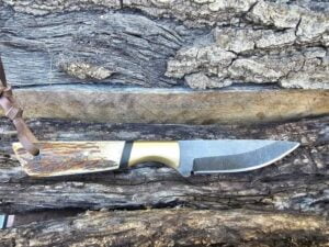 A beautifully crafted Cowboy Knife featuring a natural stag antler handle and a hand-forged D2 tool steel blade.