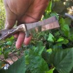 Handcrafted Rasp Bull Cutter Knife with stag antler handle and cowhide leather sheath.