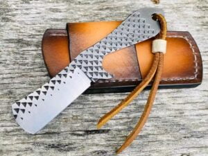 Rasp cowboy bull cutter knife with hand-forged farrier rasp steel blade and genuine cowhide leather sheath.