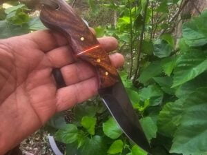 8 inch black coated cowboy knife with black rose wood handle and leather sheath