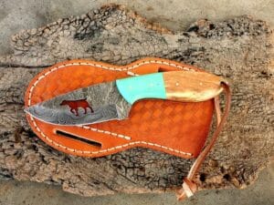 Damascus steel cowboy knife with leather sheath olive wood handle.