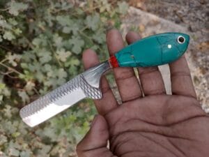 Traditional cowboy bull cutter knife with farrier rasp blade, Turquoise opaque handle and pancake leather sheath.