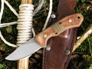 Rasp steel cowboy knife with leather sheath micarta handle.