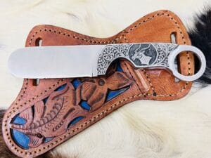 D2 tool steel bull cutter knife with fancy engraving Handmade leather sheath.