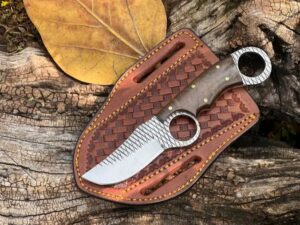 Rasp steel handmade finger hole cowboy knife with walnut wood handle and cross draw leather sheath.