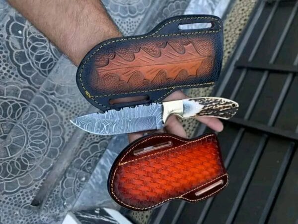 Custom handmade damascus Cowboy knife with extra leather sheath and deer antler handle.