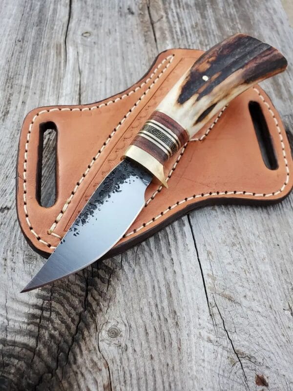 Handmade stag antler handle cowboy knife with pancake sheath.