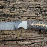 Damascus Cowboy Knife with Sheath, featuring a hand-forged blade, pine cone handle, and genuine leather sheath.