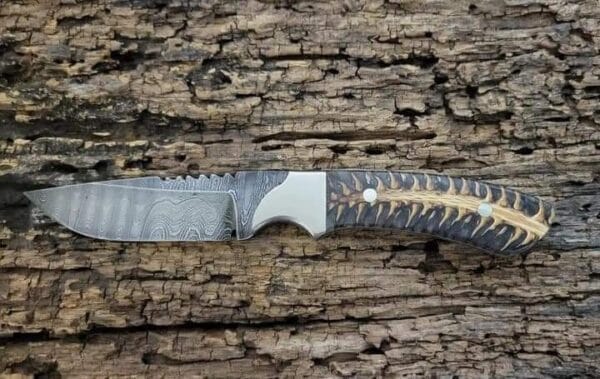 Damascus Cowboy Knife with Sheath, featuring a hand-forged blade, pine cone handle, and genuine leather sheath.