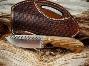 8-inch Fixed Blade Cowboy Knife with pineapple wood handle and cross draw leather sheath.