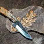 carbon steel cowboy knife with hand tooled pancake sheath