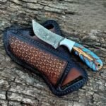 Damascus Cowboy knife with initials pinecone handle and pancake leather sheath